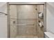 Large walk-in shower with glass enclosure and neutral tile at 152 Travis Ln, Davenport, FL 33837