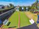 Two shuffleboard courts with benches and covered seating at 152 Travis Ln, Davenport, FL 33837