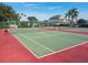 Two tennis courts with a net and surrounding fence at 152 Travis Ln, Davenport, FL 33837
