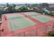 Two well-maintained tennis courts in a residential community at 152 Travis Ln, Davenport, FL 33837