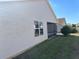 Exterior view of the home with a screened-in porch and a well-maintained yard at 2595 Edenville Path, The Villages, FL 32162
