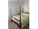 Spacious main bedroom with four-poster bed and neutral carpet at 2595 Edenville Path, The Villages, FL 32162