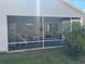 Spacious screened porch with furniture, offering a relaxing outdoor living space at 2595 Edenville Path, The Villages, FL 32162