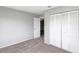 Bedroom with carpet, neutral walls, and double door closet at 801 Egret Ct, Edgewater, FL 32141