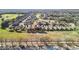 Community aerial shot displaying homes near green space and trees at 22004 Belgian Ct, Mount Dora, FL 32757