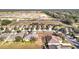 An aerial perspective highlights a residential area with houses, green lawns, and nearby construction, offering a glimpse of community living at 22004 Belgian Ct, Mount Dora, FL 32757