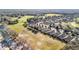 Aerial view of community featuring homes near scenic green space and trees at 22004 Belgian Ct, Mount Dora, FL 32757
