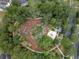 A sprawling playground surrounded by green trees and green space, offering a safe and engaging play area for children at 22004 Belgian Ct, Mount Dora, FL 32757