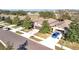 Aerial view of a neighborhood showcasing well-maintained lawns, mature trees, and a variety of home styles with attached garages at 22004 Belgian Ct, Mount Dora, FL 32757