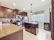 Modern kitchen features stainless steel appliances, granite countertops, and a tile backsplash at 22004 Belgian Ct, Mount Dora, FL 32757