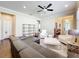 Comfortable living room with hardwood floors, a ceiling fan, and a view to the front entryway at 22004 Belgian Ct, Mount Dora, FL 32757