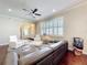 Bright living room features a ceiling fan, stylish furniture, and hardwood floors at 22004 Belgian Ct, Mount Dora, FL 32757