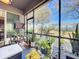 View from screened-in patio overlooking the backyard with plants and a wooden fence at 22004 Belgian Ct, Mount Dora, FL 32757