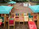 Playground with slides, a climbing wall, and other activity areas for children at 22004 Belgian Ct, Mount Dora, FL 32757