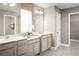 Double vanity bathroom with beige cabinets and tiled floor at 7405 Sw 108Th St, Ocala, FL 34476