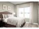 Cozy bedroom with double bed and large window at 7405 Sw 108Th St, Ocala, FL 34476