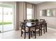Casual dining area with dark wood table and beige chairs at 7405 Sw 108Th St, Ocala, FL 34476