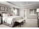 Large main bedroom with king-size bed and ensuite bathroom at 7405 Sw 108Th St, Ocala, FL 34476