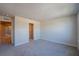 Neutral bedroom with carpet flooring features a walk-in closet and doorway to another room at 633 Highfalls Ave, Debary, FL 32713