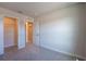 Bedroom features carpet floors, neutral walls, a closet, and a doorway at 633 Highfalls Ave, Debary, FL 32713