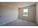 Bedroom with carpet floors and neutral walls has a single window, and multiple power outlets at 633 Highfalls Ave, Debary, FL 32713