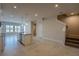 Beautiful eat-in kitchen with an island, granite countertops, stainless appliances, and a staircase nearby at 633 Highfalls Ave, Debary, FL 32713