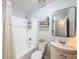 Cozy bathroom with white tile, updated fixtures, and decorative shelving for a clean and stylish look at 1531 Ne 38Th St, Ocala, FL 34479