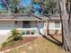 Charming single-story home featuring a well-manicured lawn, attached garage, and inviting front entrance at 1531 Ne 38Th St, Ocala, FL 34479