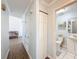 Bright hallway leads to a well-maintained bathroom, highlighting seamless home connectivity and functionality at 1531 Ne 38Th St, Ocala, FL 34479