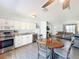 Bright kitchen boasts stainless steel appliances and open layout to a dining area with wood table and chairs at 1531 Ne 38Th St, Ocala, FL 34479