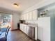 Bright kitchen features stainless steel appliances and a backyard view through the sliding glass doors at 1531 Ne 38Th St, Ocala, FL 34479