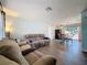 Open-concept living space with a sofa and dining area with wood-look flooring at 1531 Ne 38Th St, Ocala, FL 34479