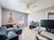 Office featuring a ceiling fan, corner couch, workstation, and bright lighting at 1531 Ne 38Th St, Ocala, FL 34479