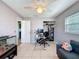 Office featuring a ceiling fan, corner couch, workstation, and neutral colors at 1531 Ne 38Th St, Ocala, FL 34479