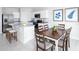 Open kitchen concept with island seating and a dining table nearby at 355 Biltmore Blvd, Dundee, FL 33838