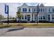 Charming two-story townhome with a welcoming front porch and manicured landscaping at 629 Highfalls Ave, Debary, FL 32713