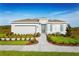 Charming one-story home with a two car garage, a well maintained yard, and a neatly layed walkway at 1624 Covey Rise Ter, Winter Haven, FL 33884