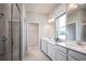 Contemporary bathroom boasts double vanity, glass shower, and a walk-in closet at 1628 Covey Rise Ter, Winter Haven, FL 33884