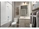 Bright bathroom with a shower-tub combo, contemporary vanity, and neutral color palette at 1632 Covey Rise Ter, Winter Haven, FL 33884