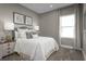 Cozy bedroom featuring a plush bed, stylish decor, and soft natural light from the window at 1632 Covey Rise Ter, Winter Haven, FL 33884