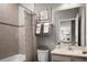 Bathroom featuring a tub, shower, single sink vanity, and stylish decor at 1636 Covey Rise Ter, Winter Haven, FL 33884