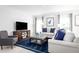 Cozy living room with comfortable seating, a modern entertainment center and elegant decor at 2152 Tennessee St, Sumterville, FL 33585