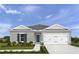 Charming single-story home with a well-manicured lawn and a two-car garage at 2158 Tennessee St, Sumterville, FL 33585