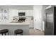 Modern kitchen features stainless steel appliances, white cabinets, and breakfast bar seating at 2158 Tennessee St, Sumterville, FL 33585