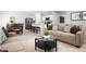 Open-concept living area with modern furnishings and seamless transition to the kitchen at 2183 Oklahoma Dr, Sumterville, FL 33585