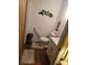Cozy bathroom features a toilet with grab bar, vanity with storage, and decorative accents at 600 Se 52Nd Ave, Ocala, FL 34471