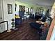 Cozy living room with hardwood floors, comfortable seating, and decorative accents at 600 Se 52Nd Ave, Ocala, FL 34471