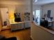 View of the living room area with hardwood floors and adjacent bathroom at 600 Se 52Nd Ave, Ocala, FL 34471