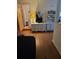 Cozy living room area with hardwood floors and adjacent bathroom at 600 Se 52Nd Ave, Ocala, FL 34471