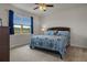 Comfortable bedroom with a large window and neutral decor, creating a relaxing and inviting atmosphere at 9773 Sw 63Rd Loop, Ocala, FL 34481